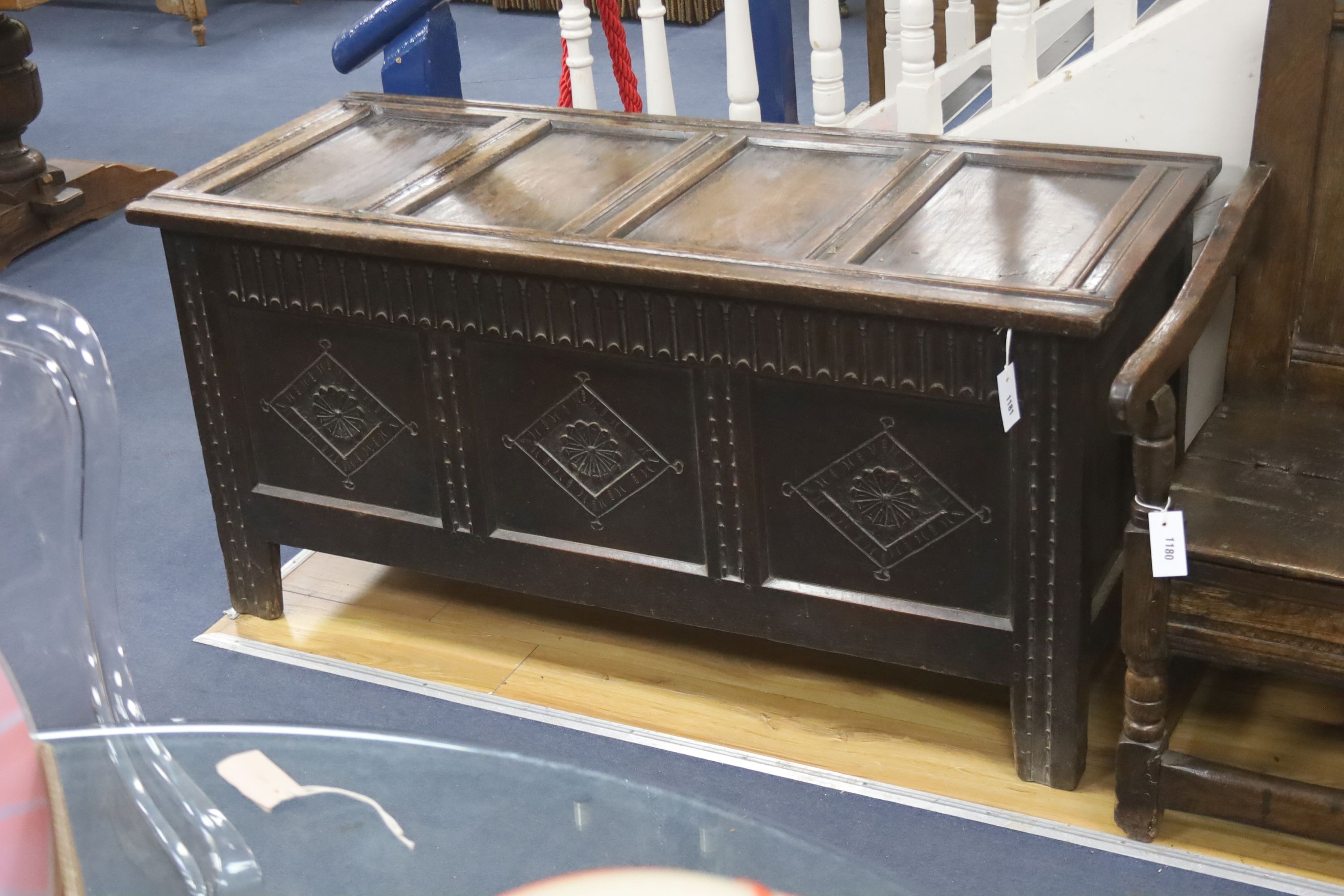 An 18th century panelled oak coffer, length 136cm, depth 57cm, height 66cm